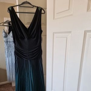 SLNY emerald green ombré gown with jeweled sleeve .
